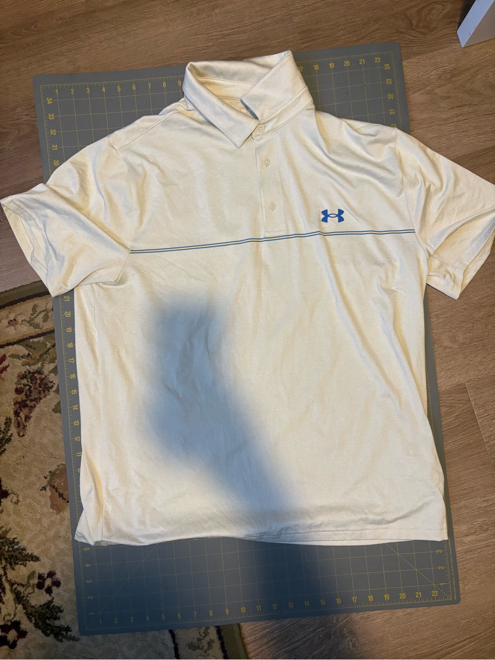 Under Armour Men’s White The Playoff Polo Shirt with Blue Logo